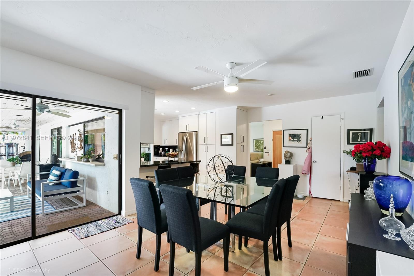 9860 Southwest 122nd Street Miami, FL 33176 - Photo 13 of 27 a view of a dining room with furniture and wooden floor