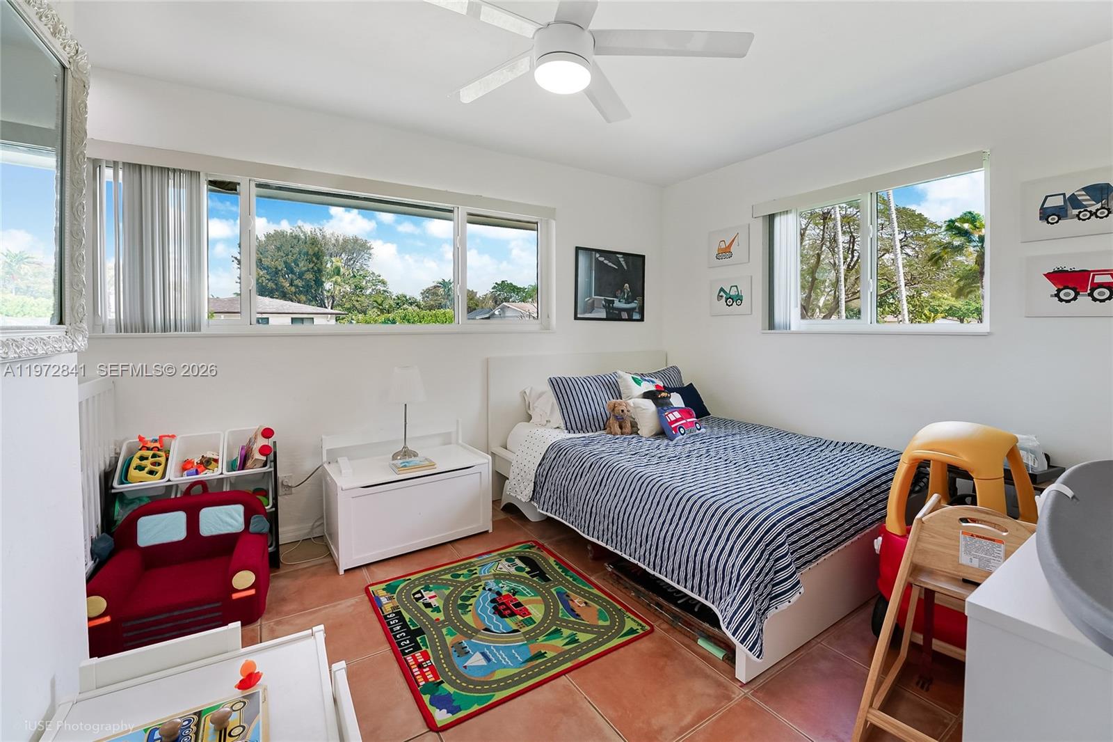 9860 Southwest 122nd Street Miami, FL 33176 - Photo 16 of 27 a bedroom with a bed and a window