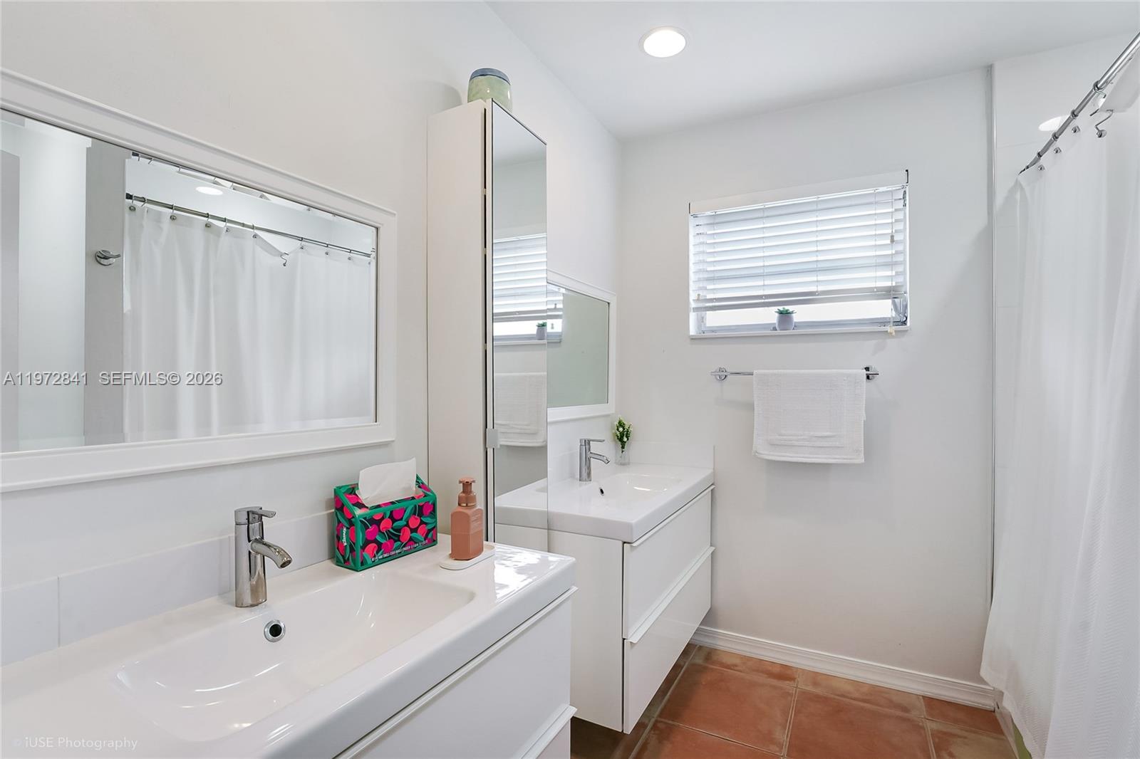 9860 Southwest 122nd Street Miami, FL 33176 - Photo 17 of 27 a bathroom with a sink and a bathtub
