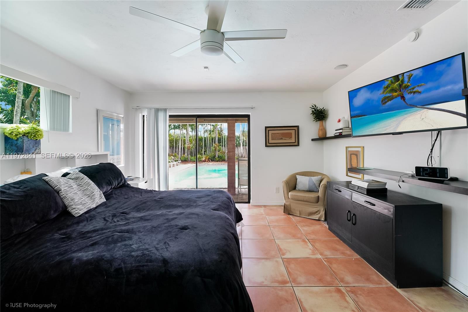 9860 Southwest 122nd Street Miami, FL 33176 - Photo 21 of 27 a bedroom with a bed and a couch