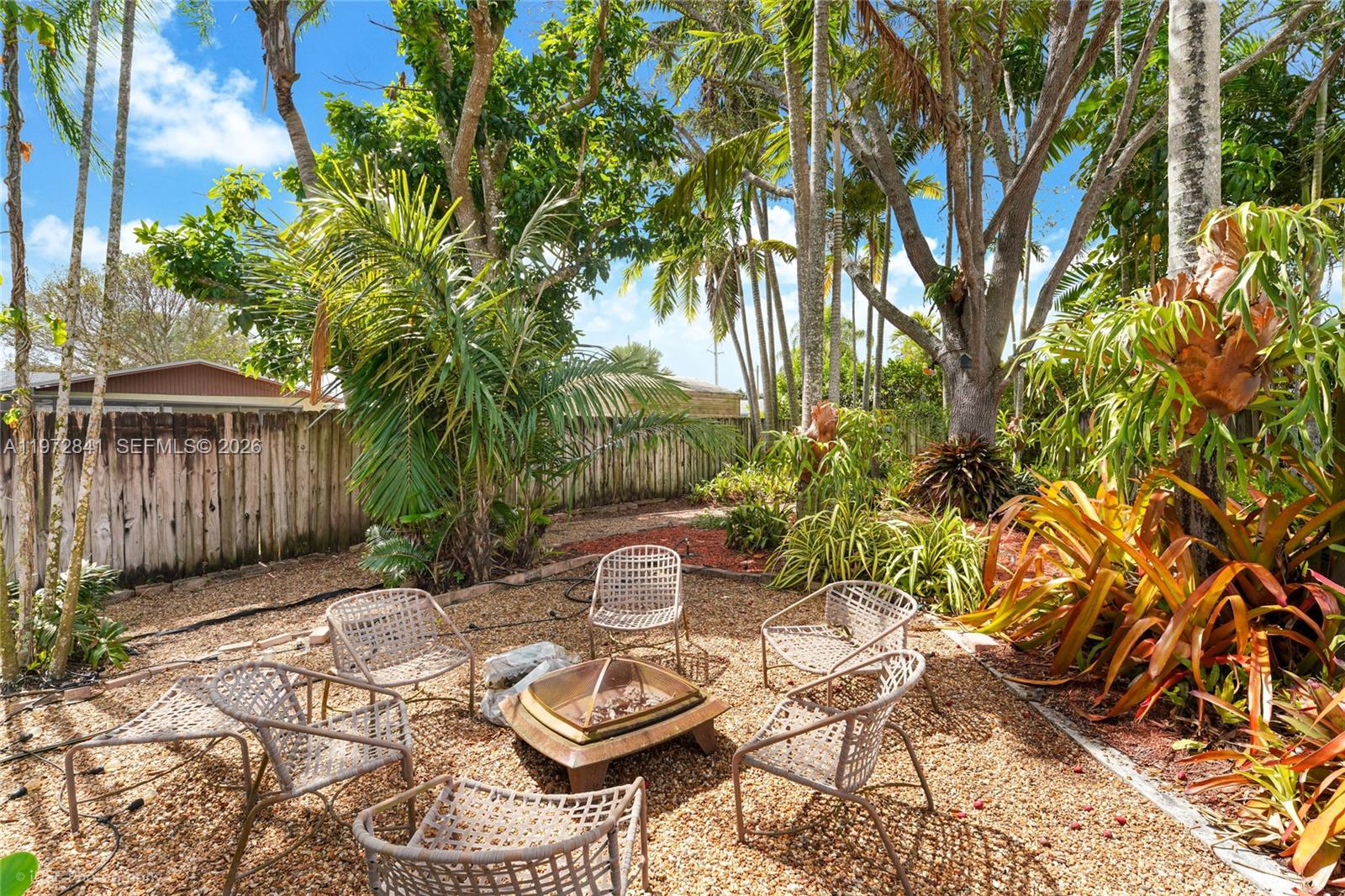 9860 Southwest 122nd Street Miami, FL 33176 - Photo 25 of 27 a view of a backyard with sitting area and furniture