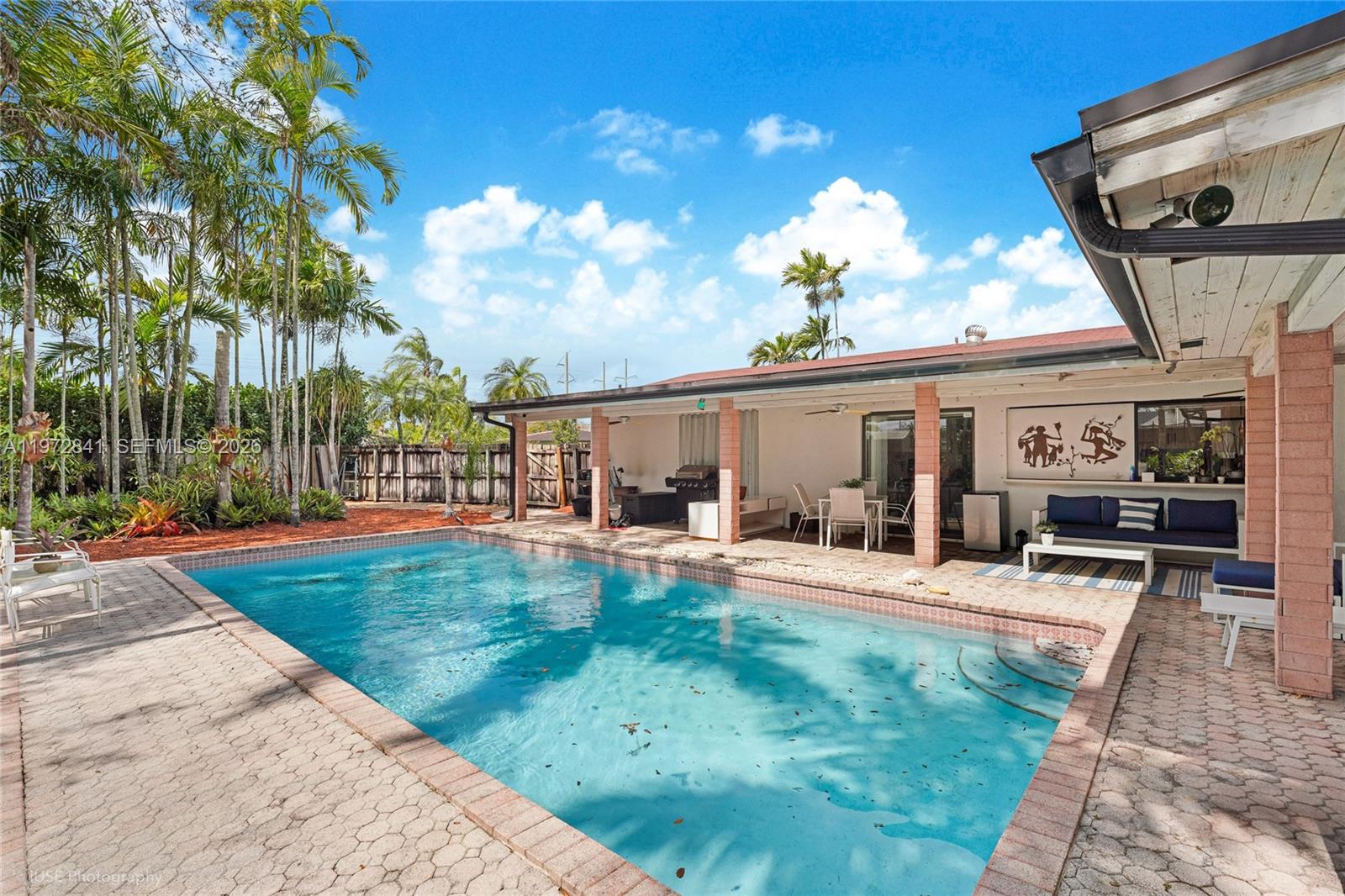 9860 Southwest 122nd Street Miami, FL 33176 - Photo 3 of 27 a view of a house with backyard and sitting area