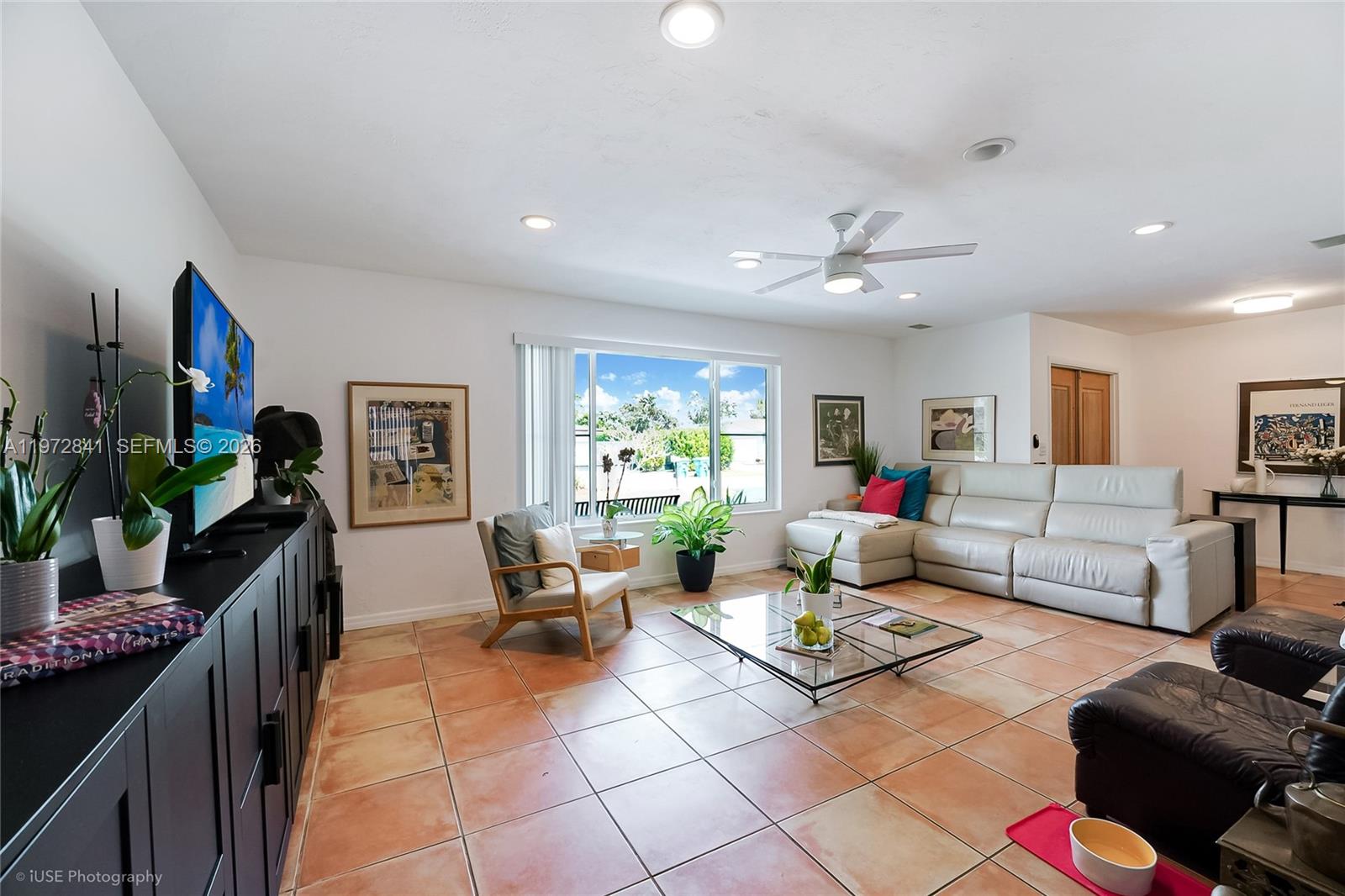 9860 Southwest 122nd Street Miami, FL 33176 - Photo 6 of 27 a living room with furniture and a potted plant