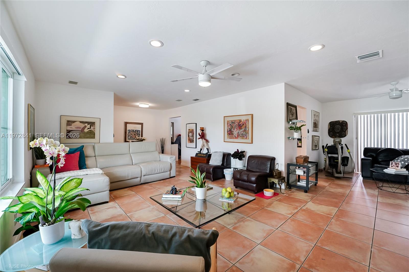 9860 Southwest 122nd Street Miami, FL 33176 - Photo 7 of 27 a living room with furniture kitchen view and a large window