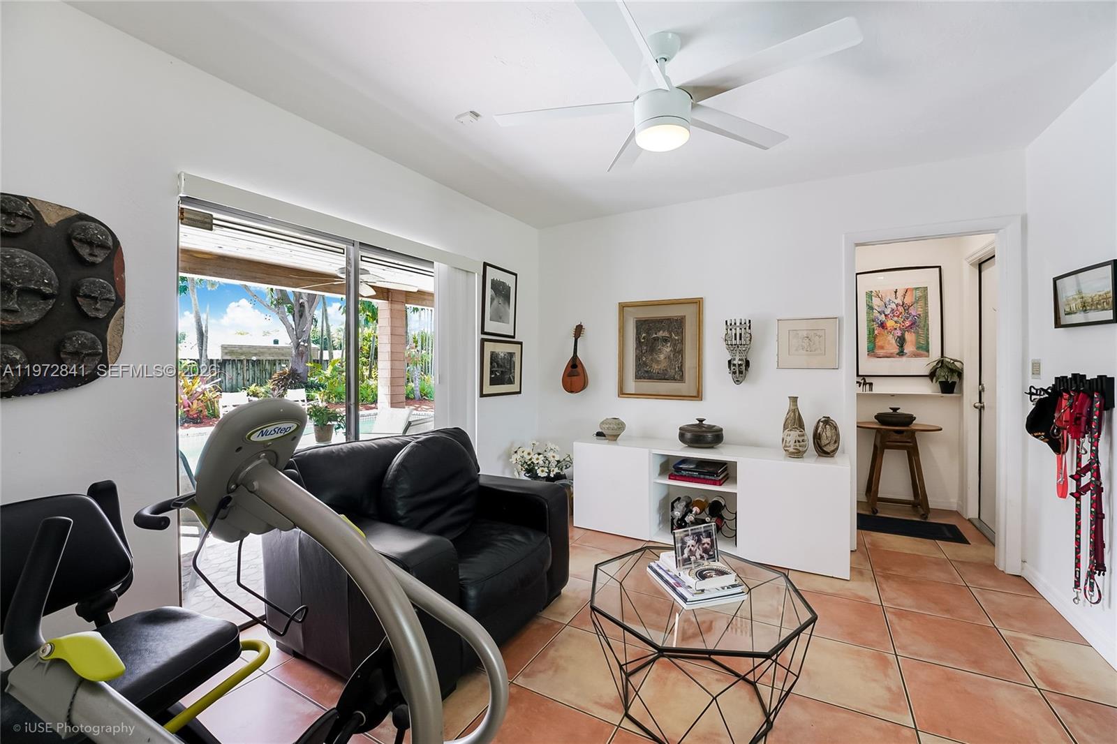 9860 Southwest 122nd Street Miami, FL 33176 - Photo 10 of 27 a living room with furniture and a large window