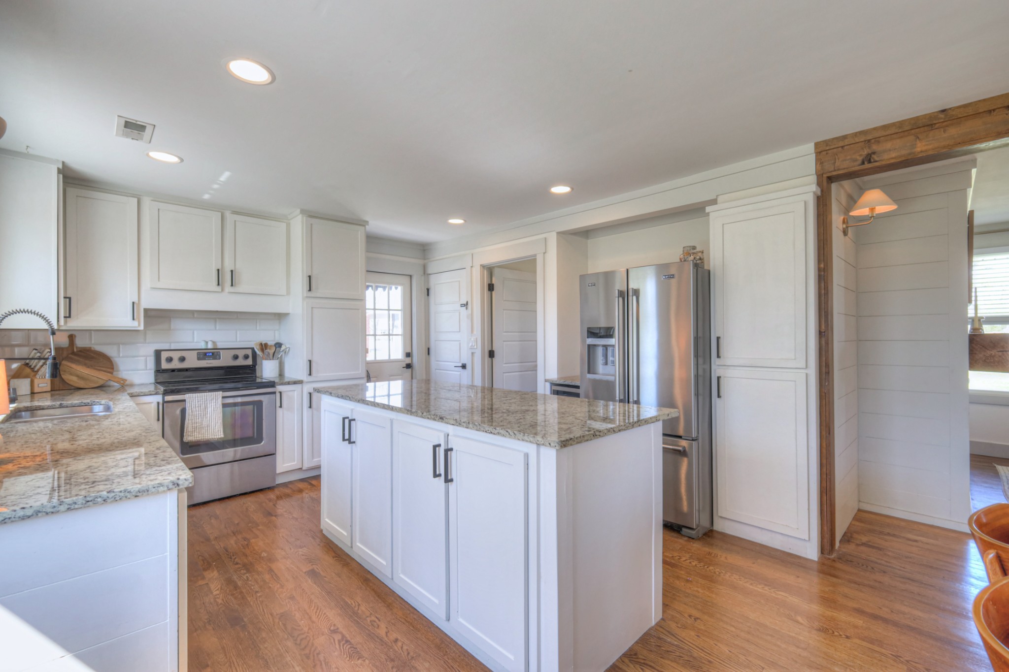 691 Harding Place Nashville, TN 37211 - Photo 24 of 54 a kitchen with stainless steel appliances granite countertop a refrigerator and a stove top oven