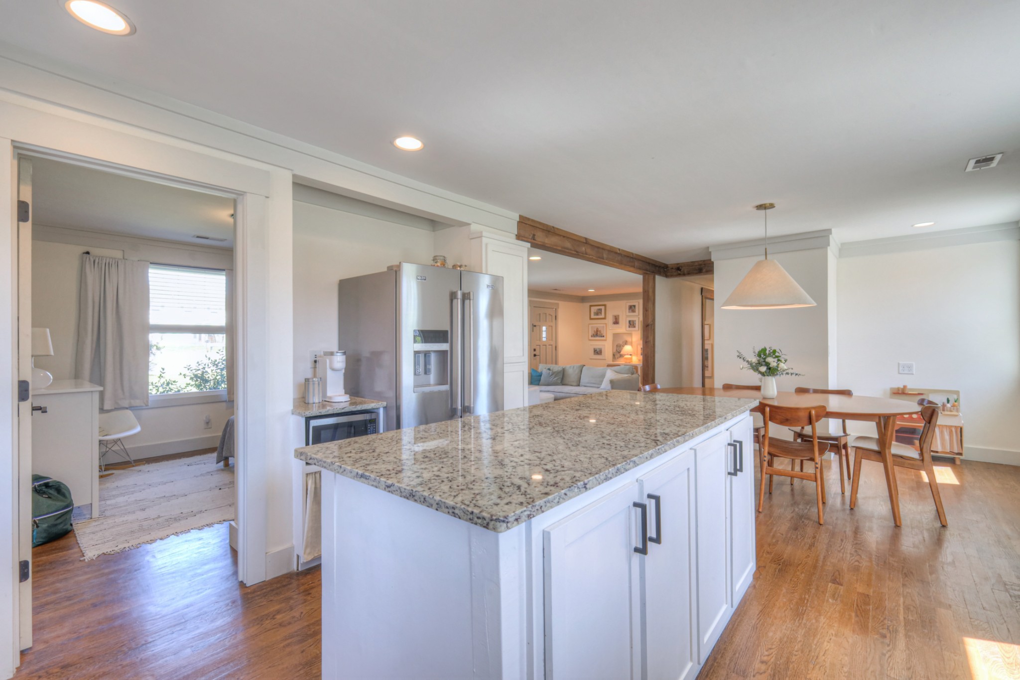 691 Harding Place Nashville, TN 37211 - Photo 28 of 54 a view of a kitchen counter top space with granite countertop wooden floor and a living room