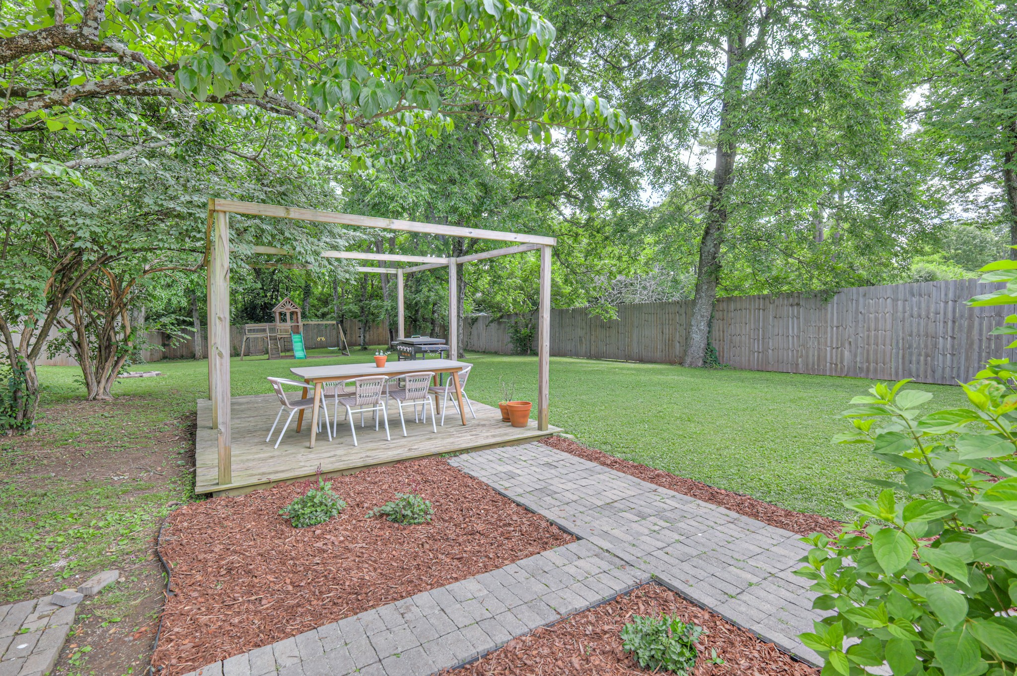 691 Harding Place Nashville, TN 37211 - Photo 37 of 54 a view of a backyard with sitting area and garden