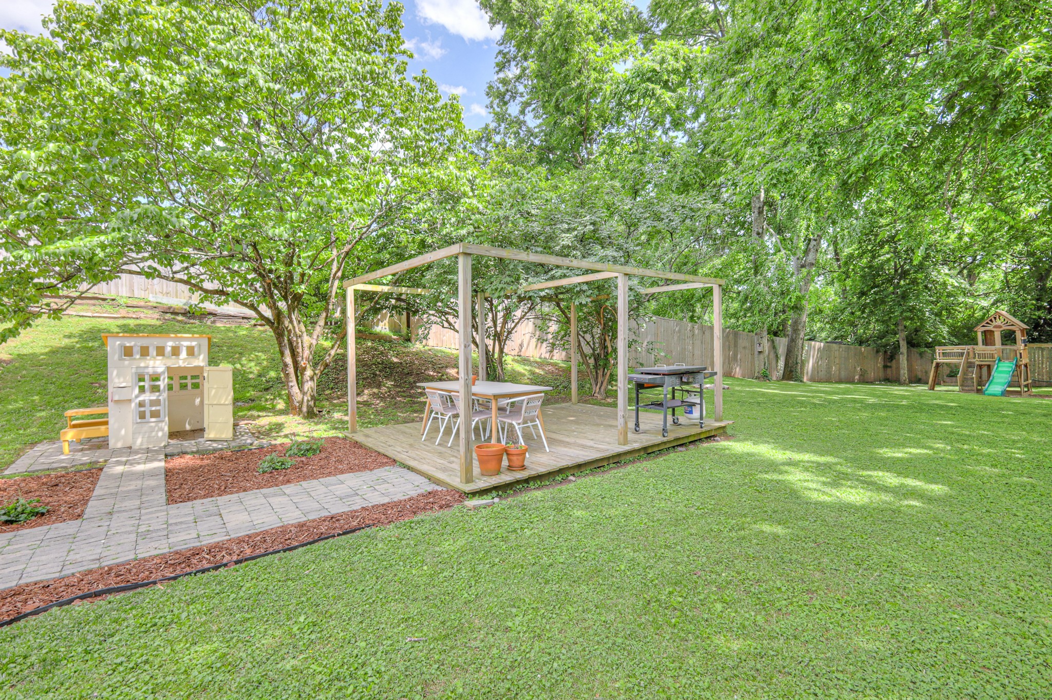 691 Harding Place Nashville, TN 37211 - Photo 40 of 54 a view of a house with a yard and sitting area
