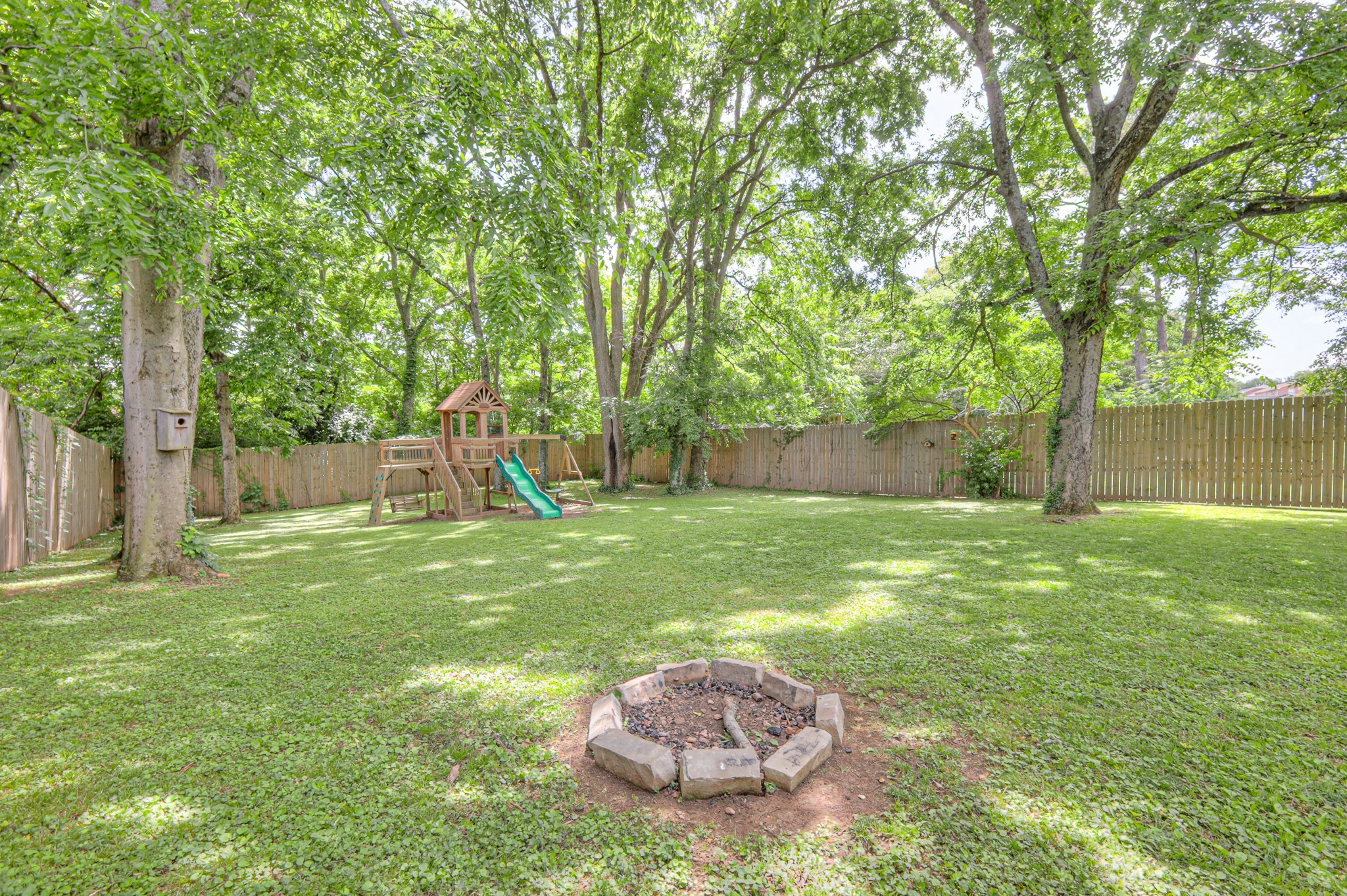 691 Harding Place Nashville, TN 37211 - Photo 43 of 54 a view of a backyard with a table and a slide