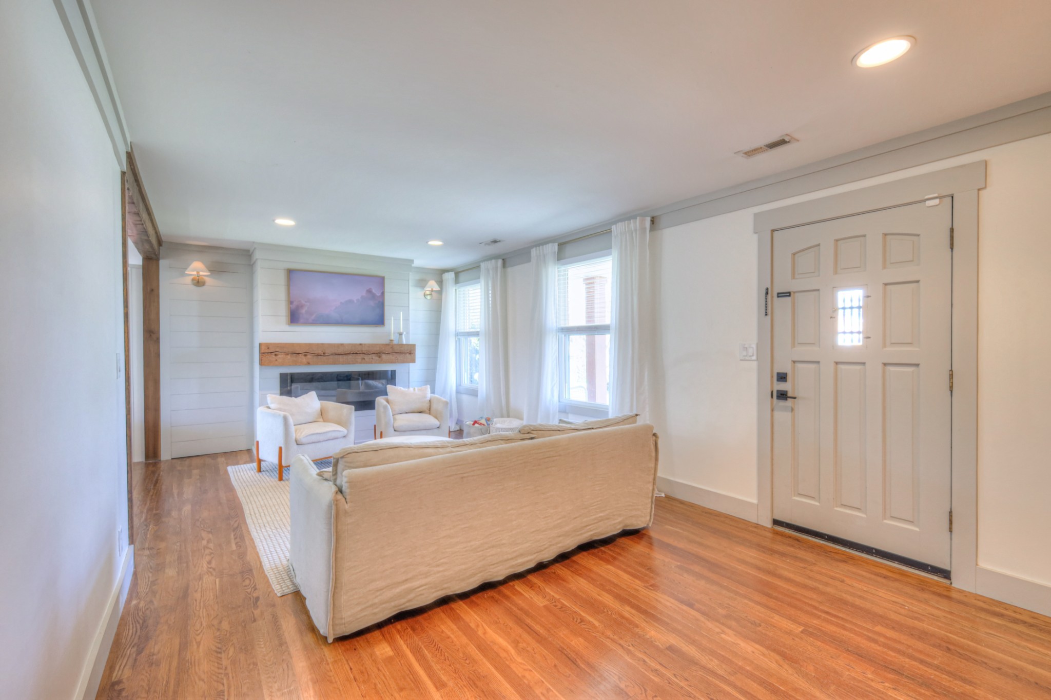 691 Harding Place Nashville, TN 37211 - Photo 8 of 54 a living room with a couch and a wooden floor