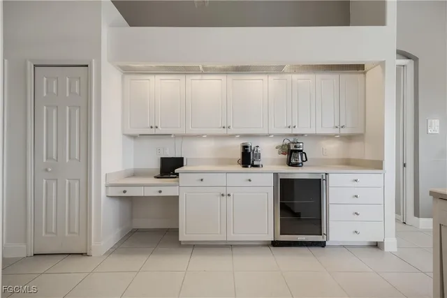 a kitchen with stainless steel appliances granite countertop a white stove top oven and cabinets