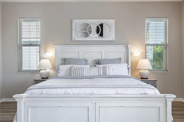 a bedroom with a bed and window