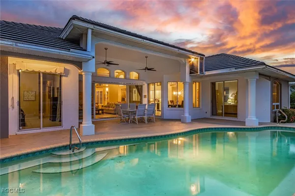 a view of a patio with swimming pool table and chairs