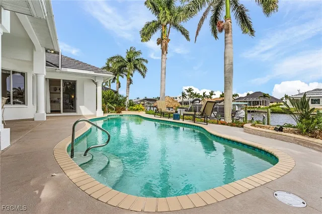 a view of a swimming pool with a terrace