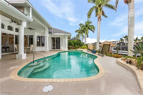 a view of a swimming pool with a patio