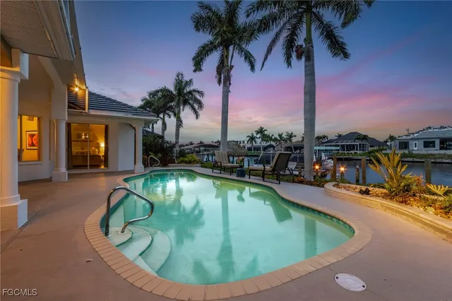 a view of a swimming pool with a lounge chairs