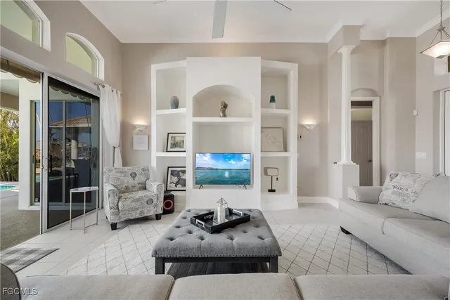 a living room with furniture or couch and a potted plant