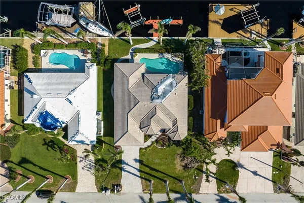 an aerial view of houses with yard