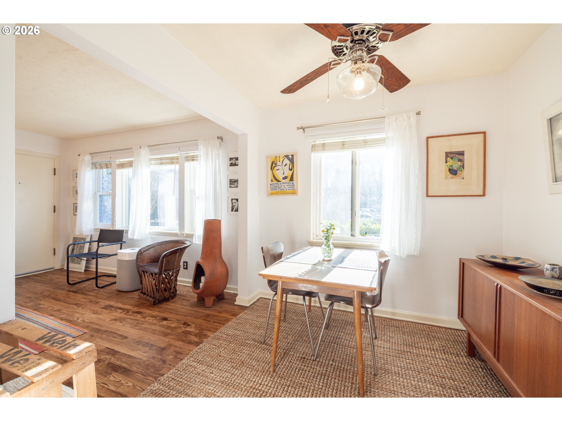 2123 Northeast Clackamas Street, Unit 5 Portland, OR 97232 - Photo 12 of 31 a living room with furniture a window and a chandelier