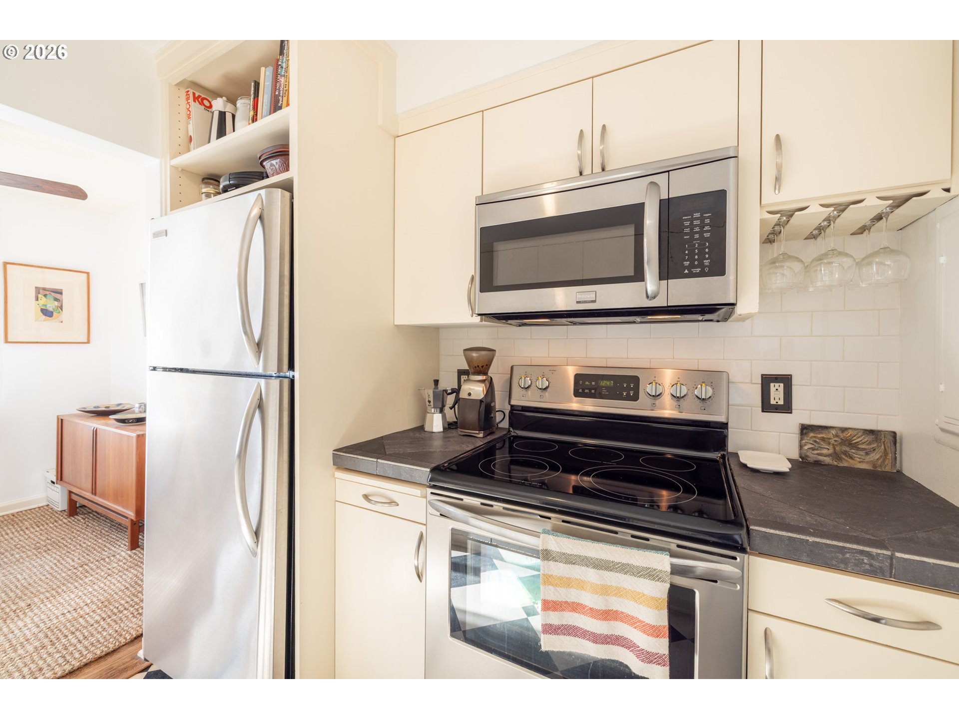 2123 Northeast Clackamas Street, Unit 5 Portland, OR 97232 - Photo 17 of 31 a kitchen with a stove and a microwave