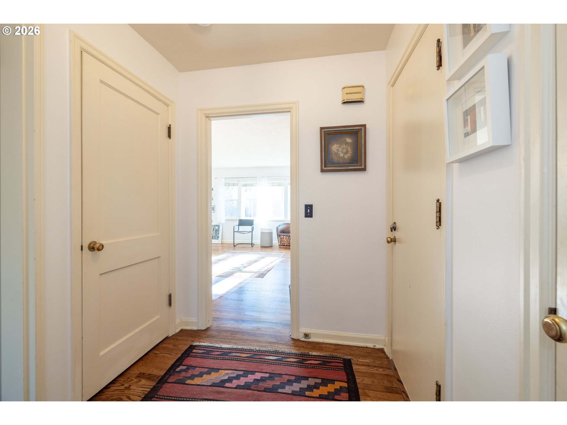 2123 Northeast Clackamas Street, Unit 5 Portland, OR 97232 - Photo 20 of 31 a view of a hallway with wooden floor and a bathroom
