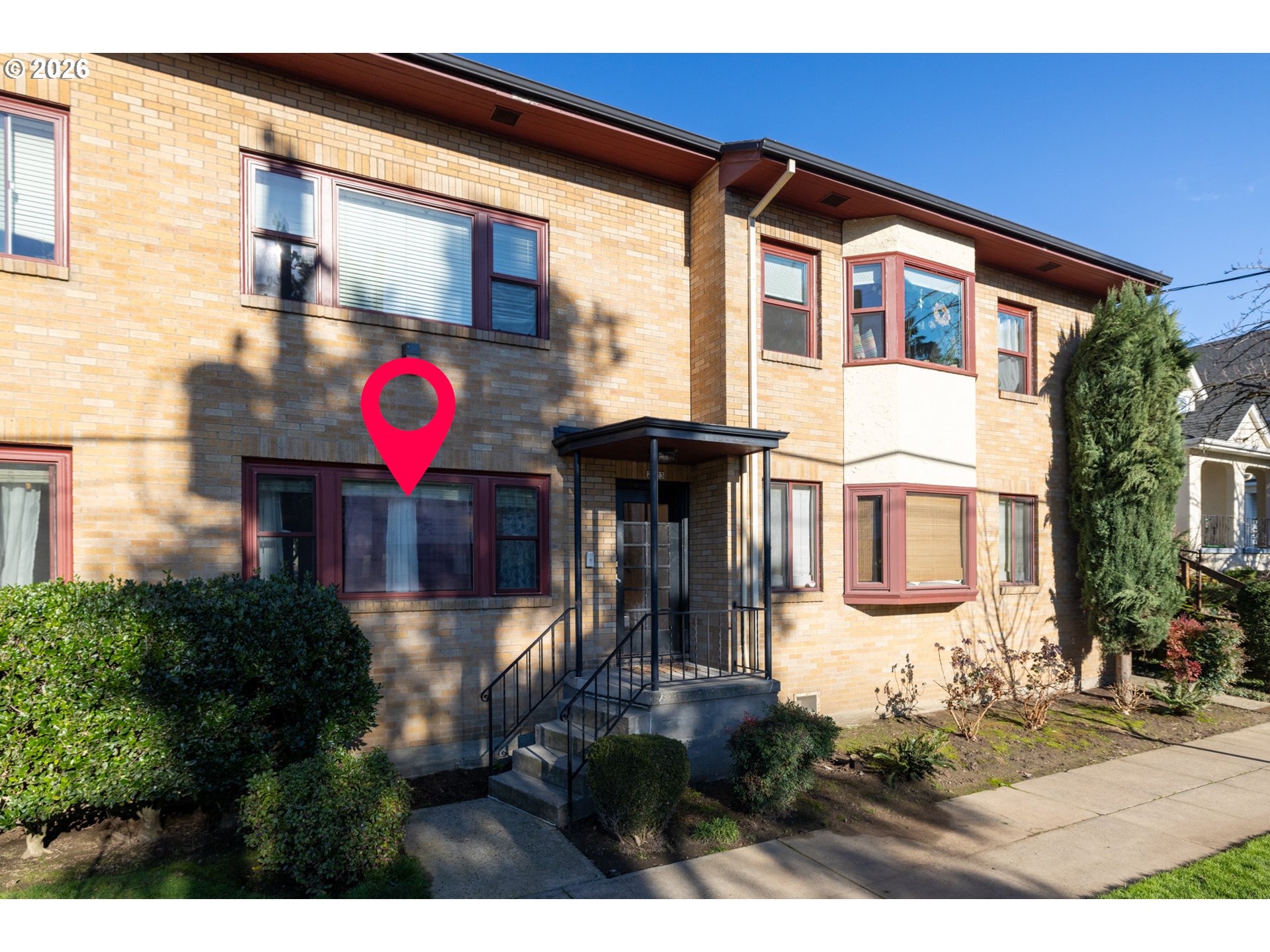 2123 Northeast Clackamas Street, Unit 5 Portland, OR 97232 - Photo 2 of 31 a front view of a house with a yard