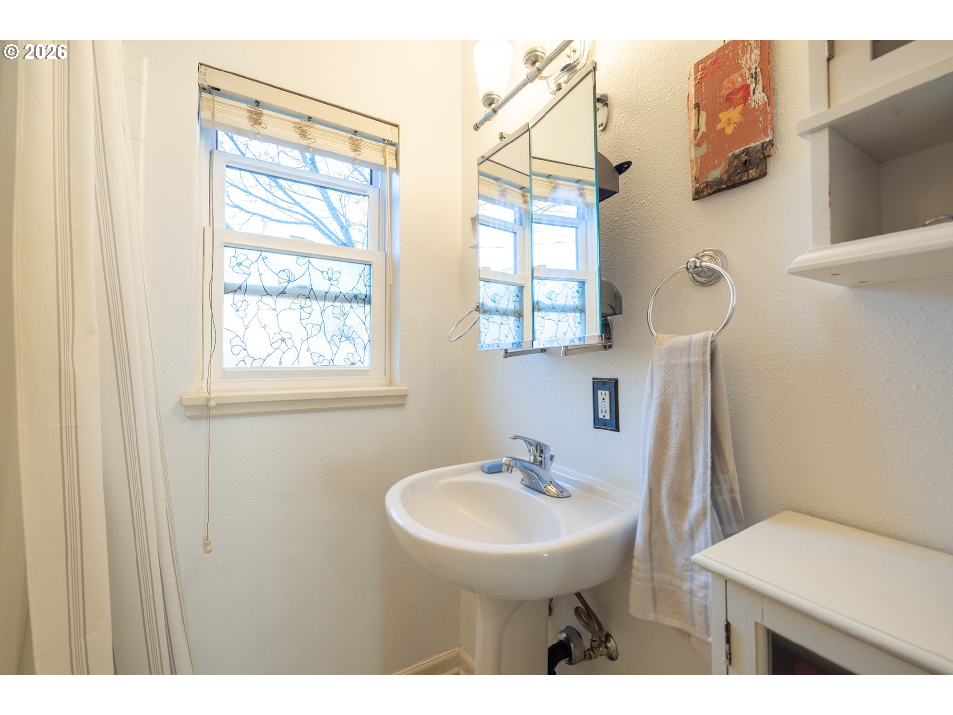 2123 Northeast Clackamas Street, Unit 5 Portland, OR 97232 - Photo 23 of 31 a bathroom with a sink a toilet and a mirror