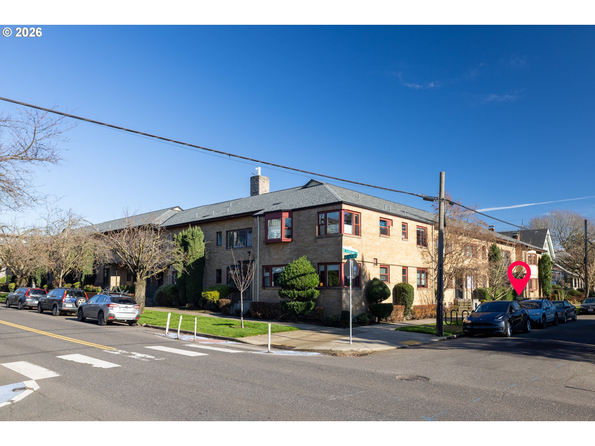 2123 Northeast Clackamas Street, Unit 5 Portland, OR 97232 - Photo 3 of 31 a view of a parked cars in front of a building