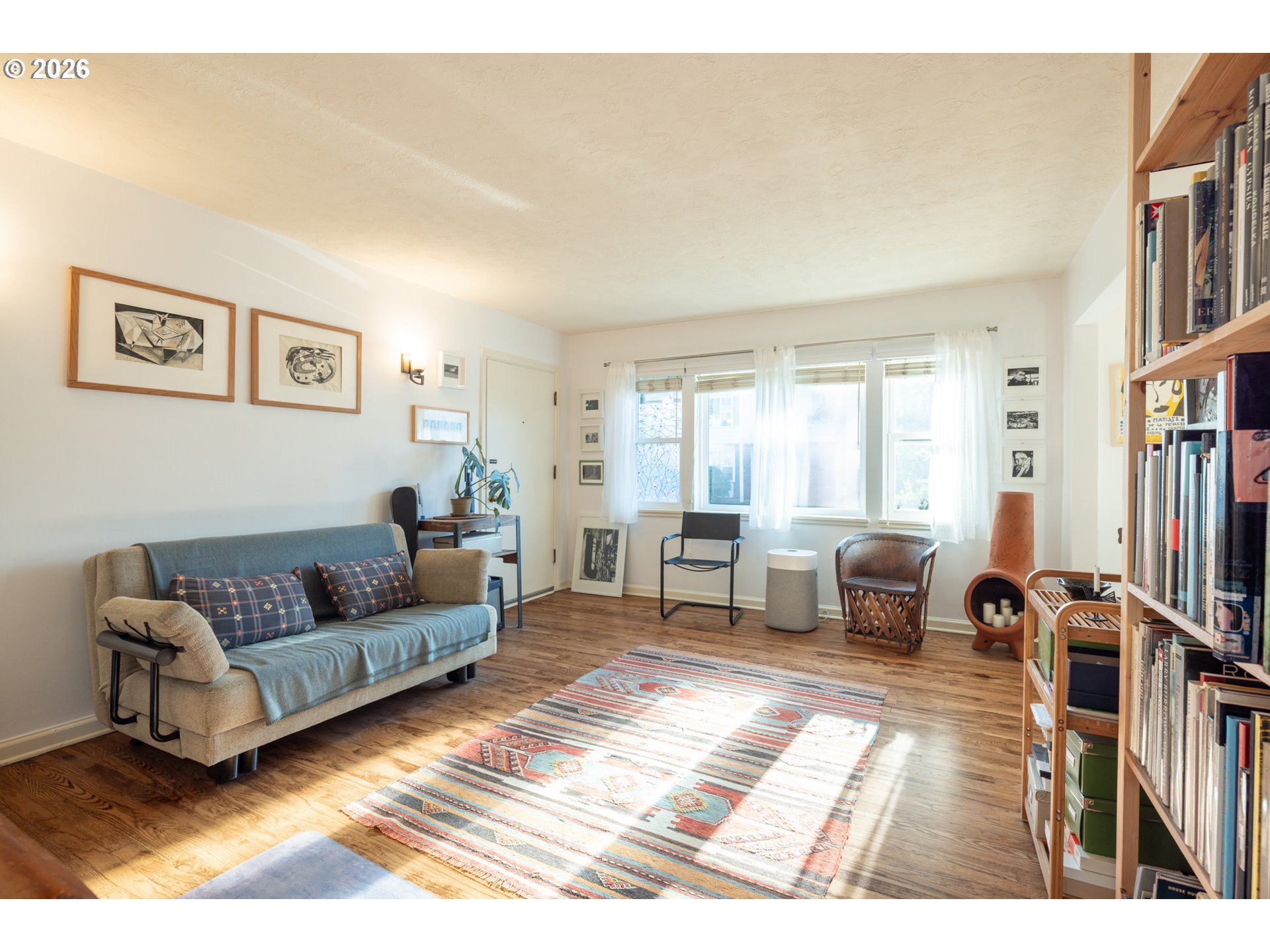 2123 Northeast Clackamas Street, Unit 5 Portland, OR 97232 - Photo 7 of 31 a living room with furniture and a large window