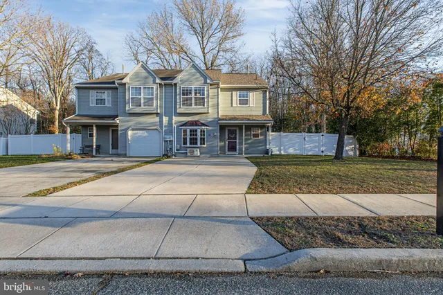 a house with palm tree in front of it