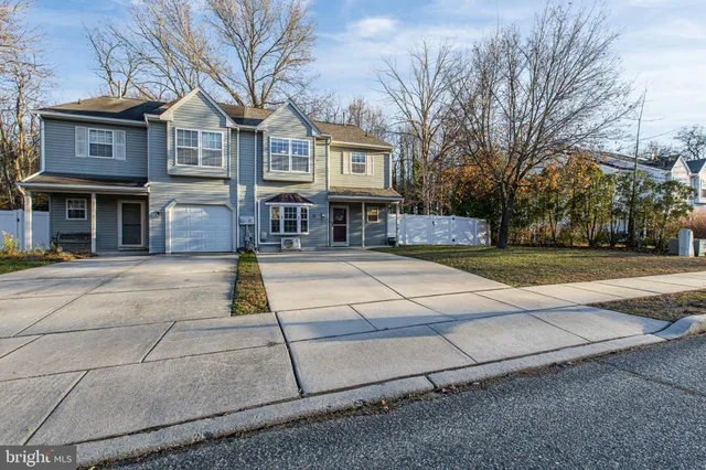 a front view of residential houses with yard