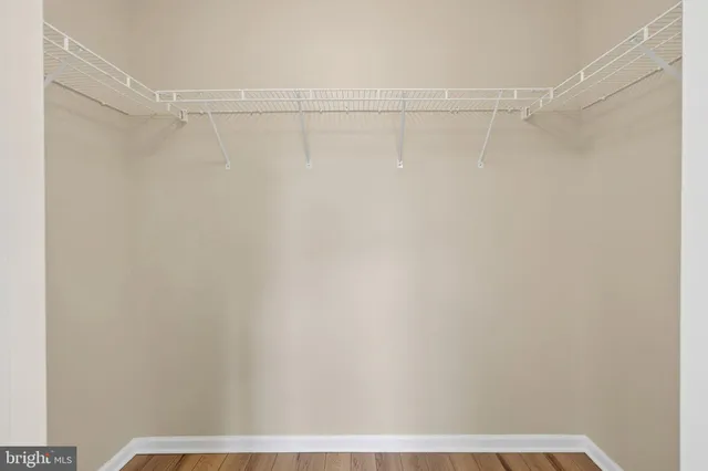 a view of a room with shelf on the wall