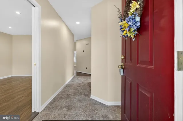 view of a hallway with wooden floor