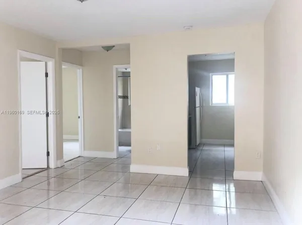 an empty room with a mirror