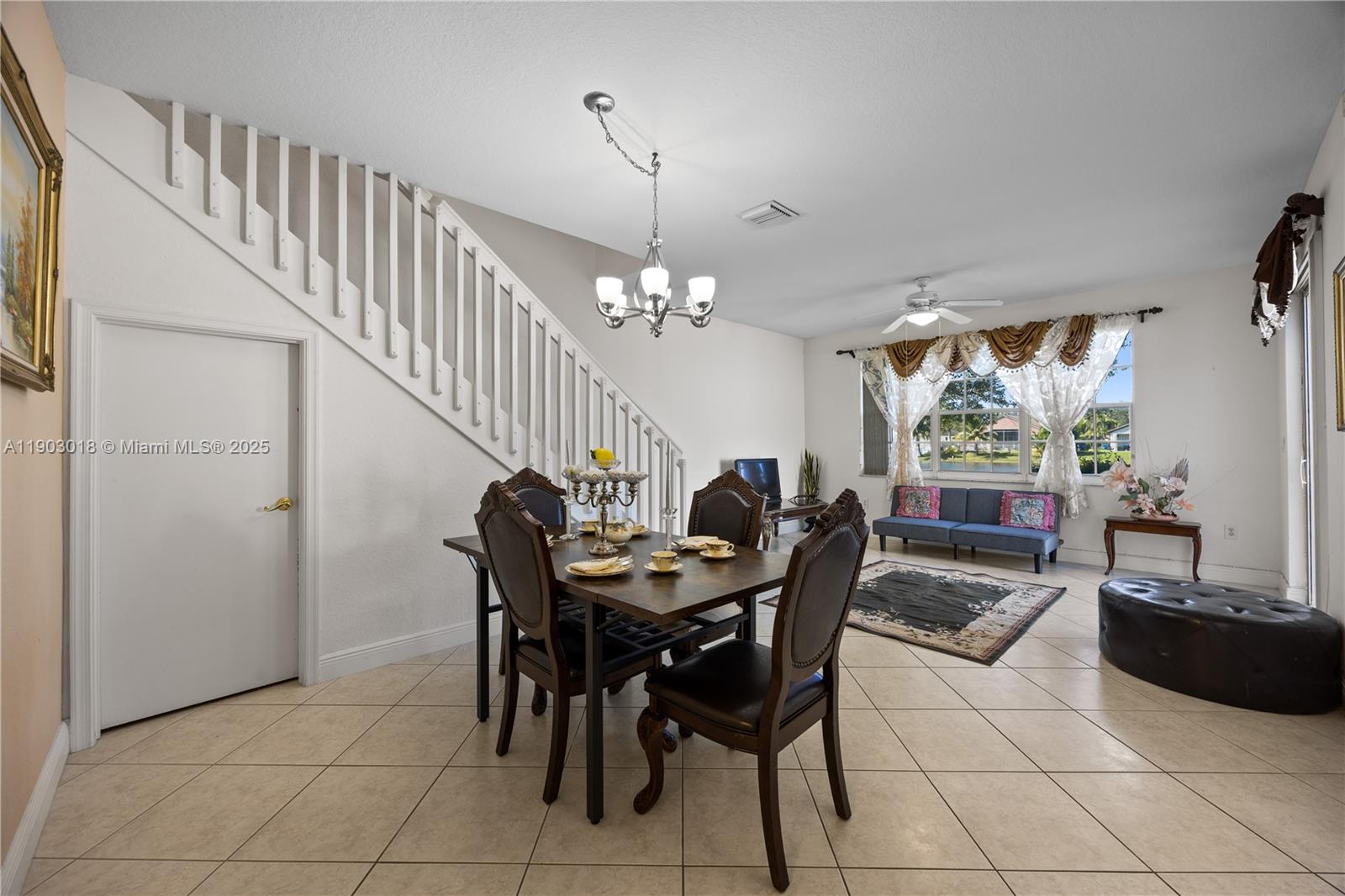 2658 Southwest 189th Avenue Miramar, FL 33029 - Photo 12 of 67 a view of a dining room with furniture and window