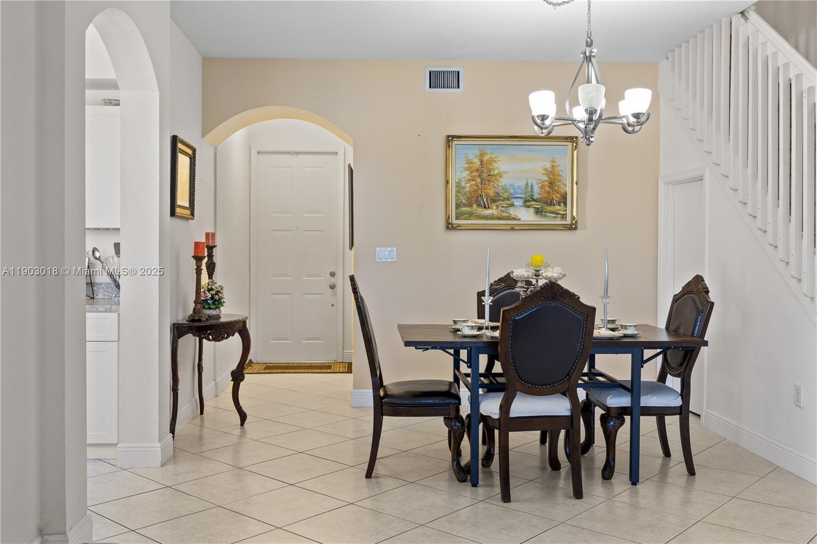 2658 Southwest 189th Avenue Miramar, FL 33029 - Photo 13 of 67 a view of a dining room with furniture and chandelier