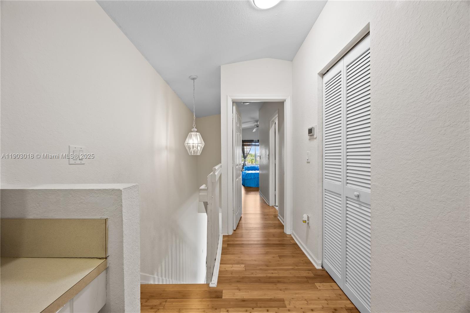 2658 Southwest 189th Avenue Miramar, FL 33029 - Photo 16 of 67 a view of a hallway with wooden floor and staircase