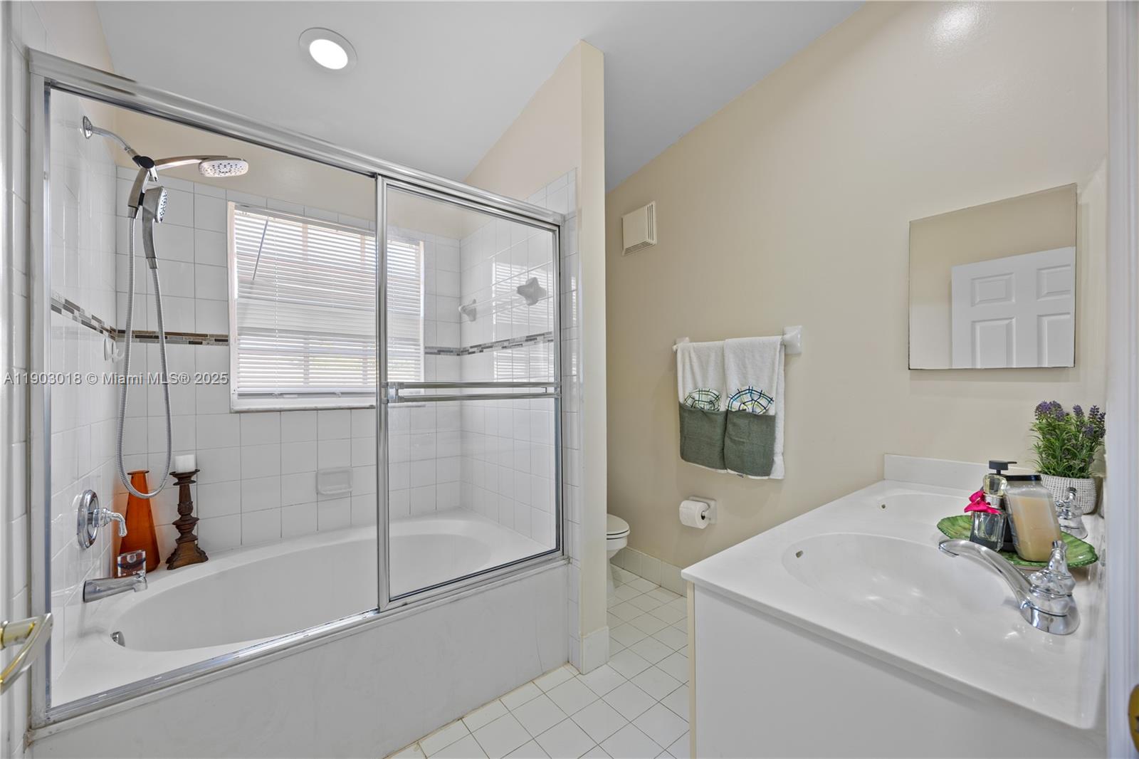 2658 Southwest 189th Avenue Miramar, FL 33029 - Photo 25 of 67 a bathroom with a sink mirror and a shower