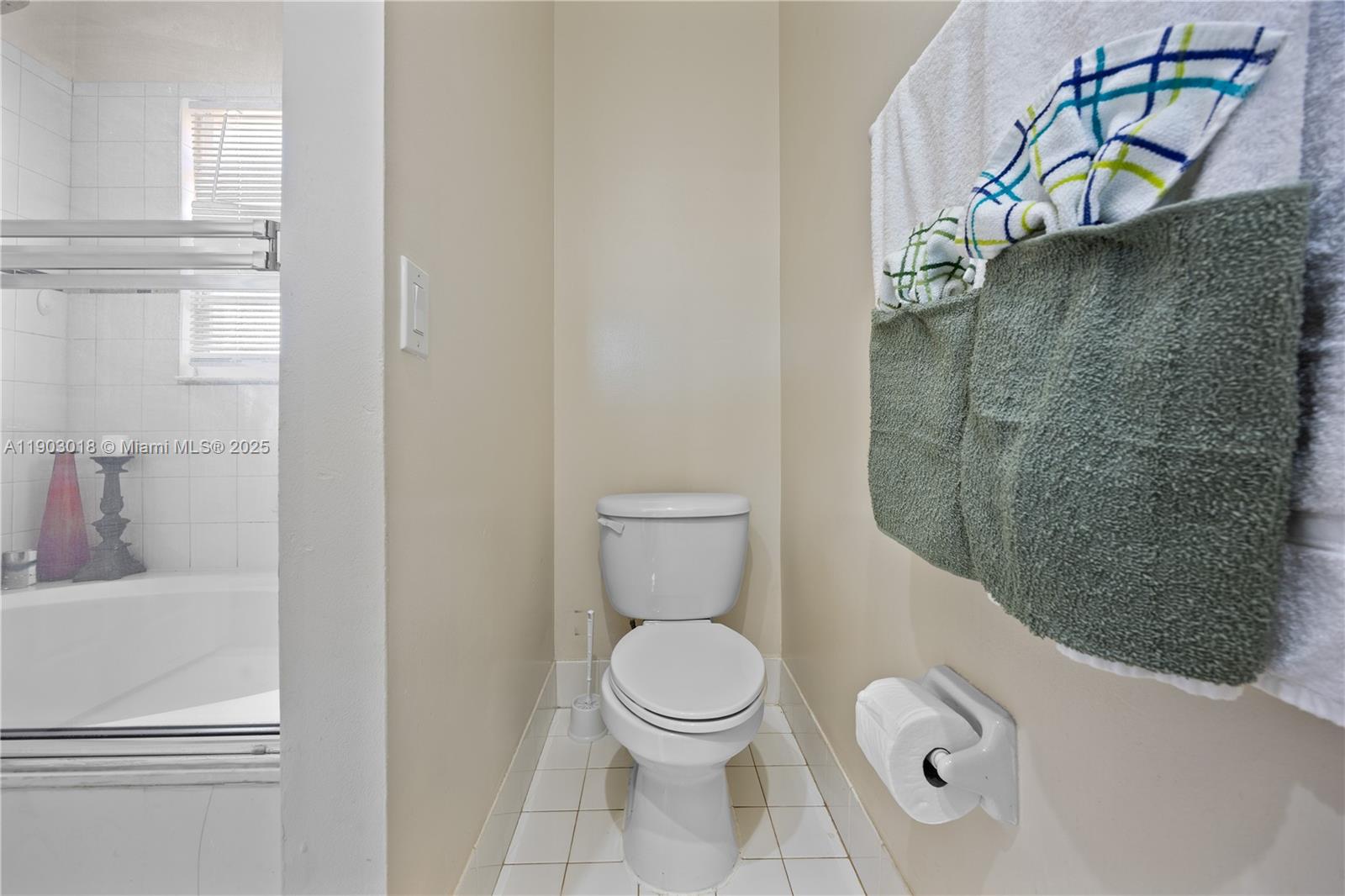 2658 Southwest 189th Avenue Miramar, FL 33029 - Photo 27 of 67 a bathroom with a toilet and a sink