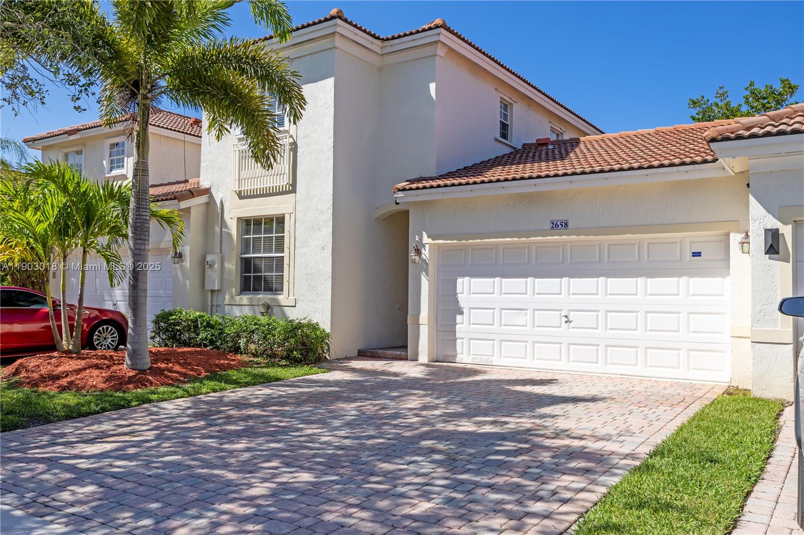 2658 Southwest 189th Avenue Miramar, FL 33029 - Photo 3 of 67 a front view of a house with a yard