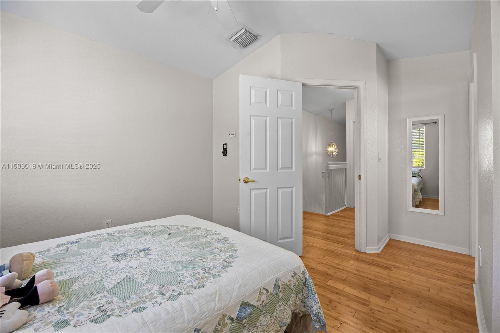 2658 Southwest 189th Avenue Miramar, FL 33029 - Photo 31 of 67 a bedroom with a bed and wooden floor