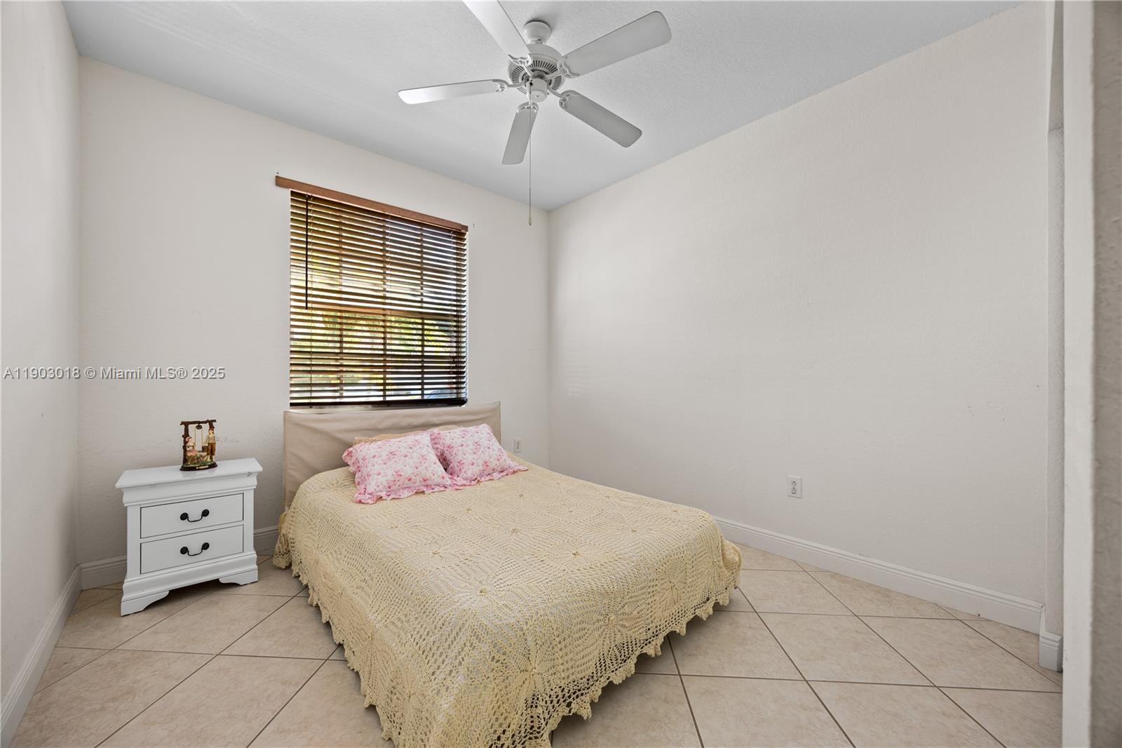 2658 Southwest 189th Avenue Miramar, FL 33029 - Photo 34 of 67 a bedroom with a bed and a window