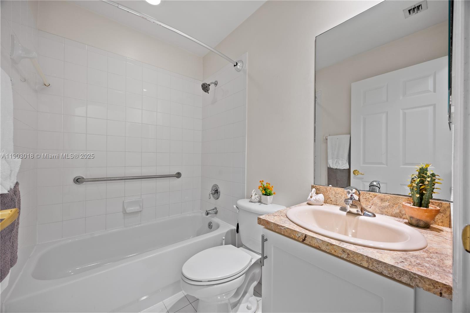 2658 Southwest 189th Avenue Miramar, FL 33029 - Photo 37 of 67 a bathroom with a granite countertop sink a toilet and a bathtub