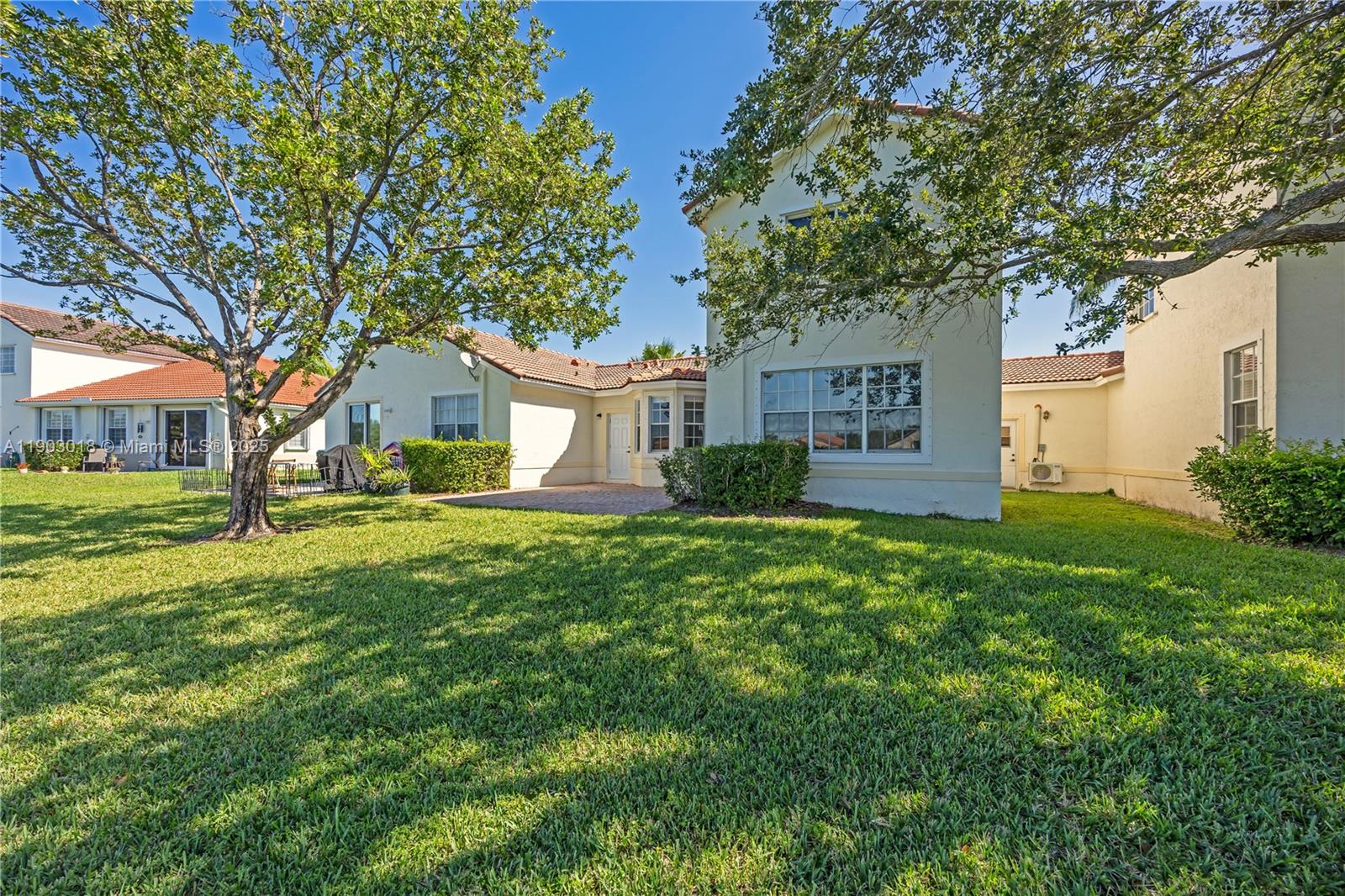 2658 Southwest 189th Avenue Miramar, FL 33029 - Photo 44 of 67 a front view of a house with garden