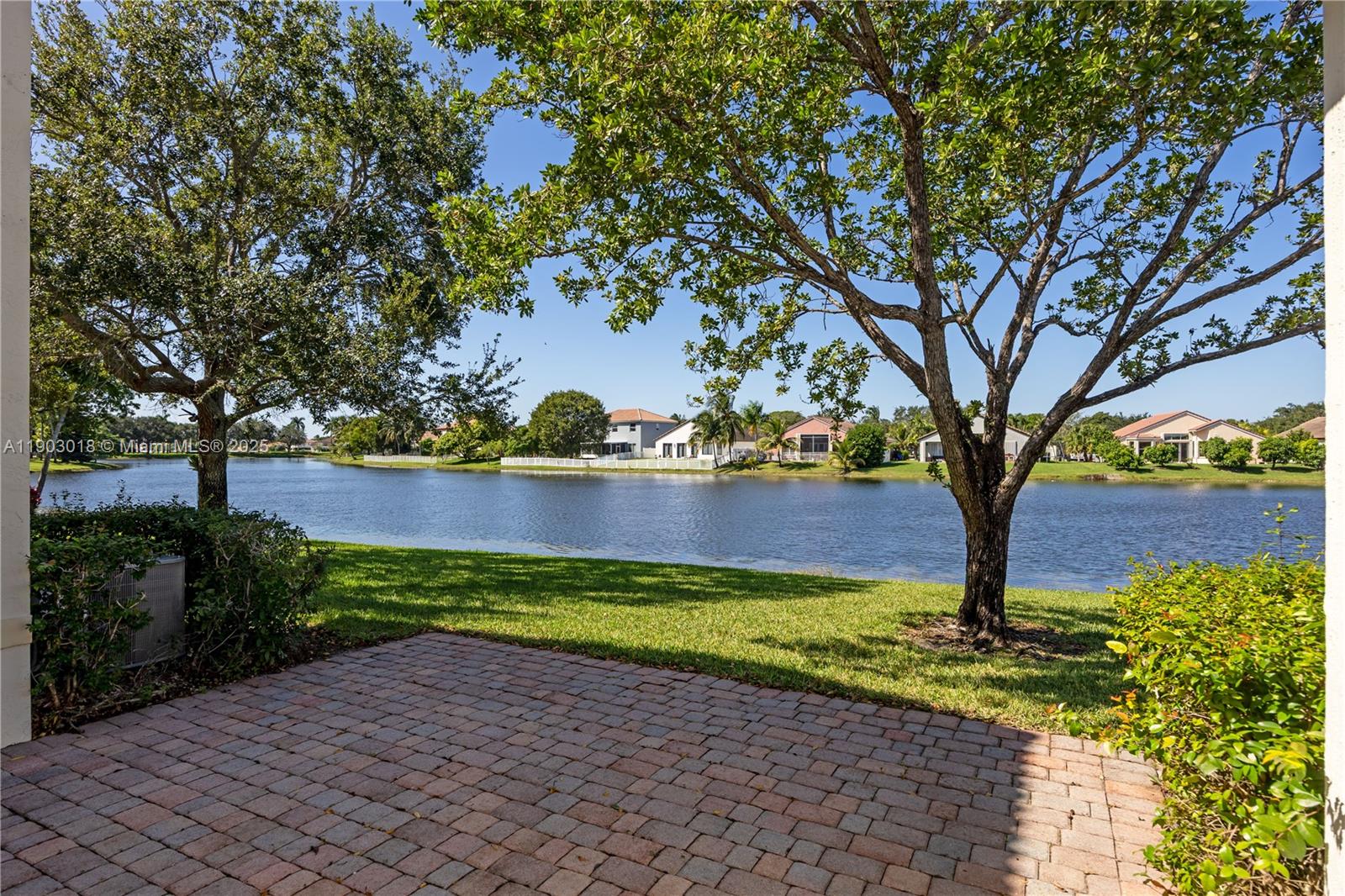 2658 Southwest 189th Avenue Miramar, FL 33029 - Photo 46 of 67 a view of a yard with plants and large trees