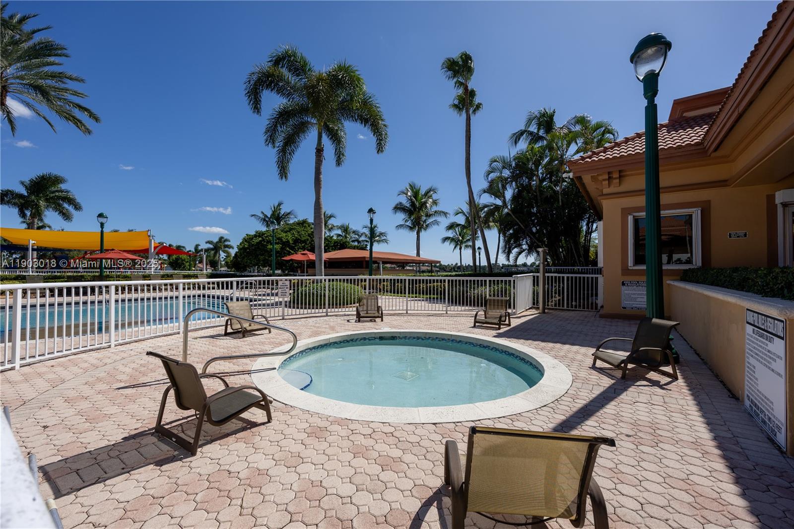 2658 Southwest 189th Avenue Miramar, FL 33029 - Photo 49 of 67 a swimming pool with outdoor seating and yard