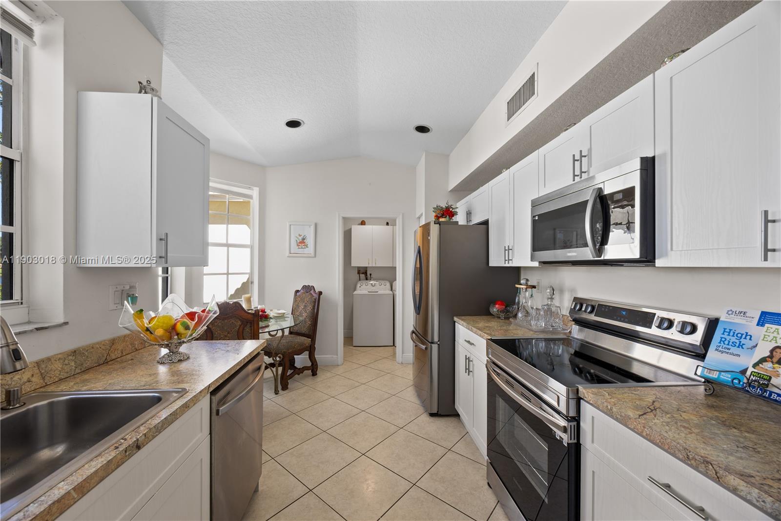 2658 Southwest 189th Avenue Miramar, FL 33029 - Photo 5 of 67 a kitchen that has a sink cabinets counter space and stainless steel appliances