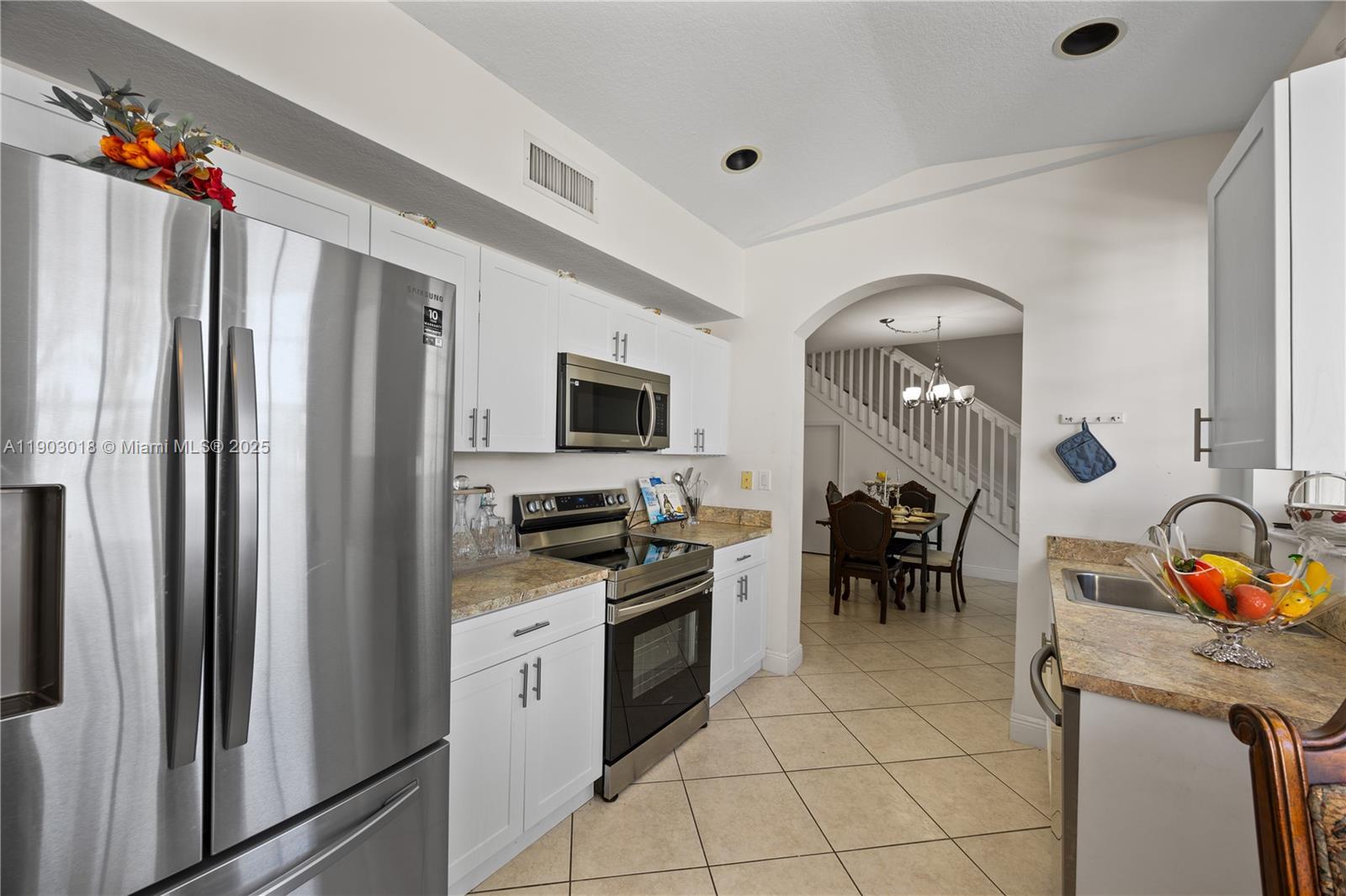 2658 Southwest 189th Avenue Miramar, FL 33029 - Photo 7 of 67 a kitchen with stainless steel appliances granite countertop a refrigerator and a stove