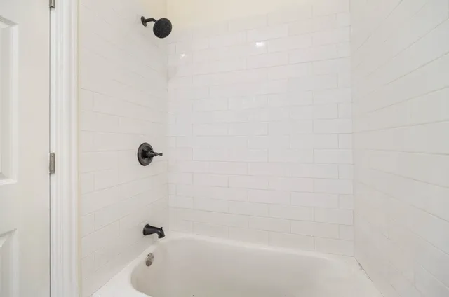 a close up of a bathtub curtain